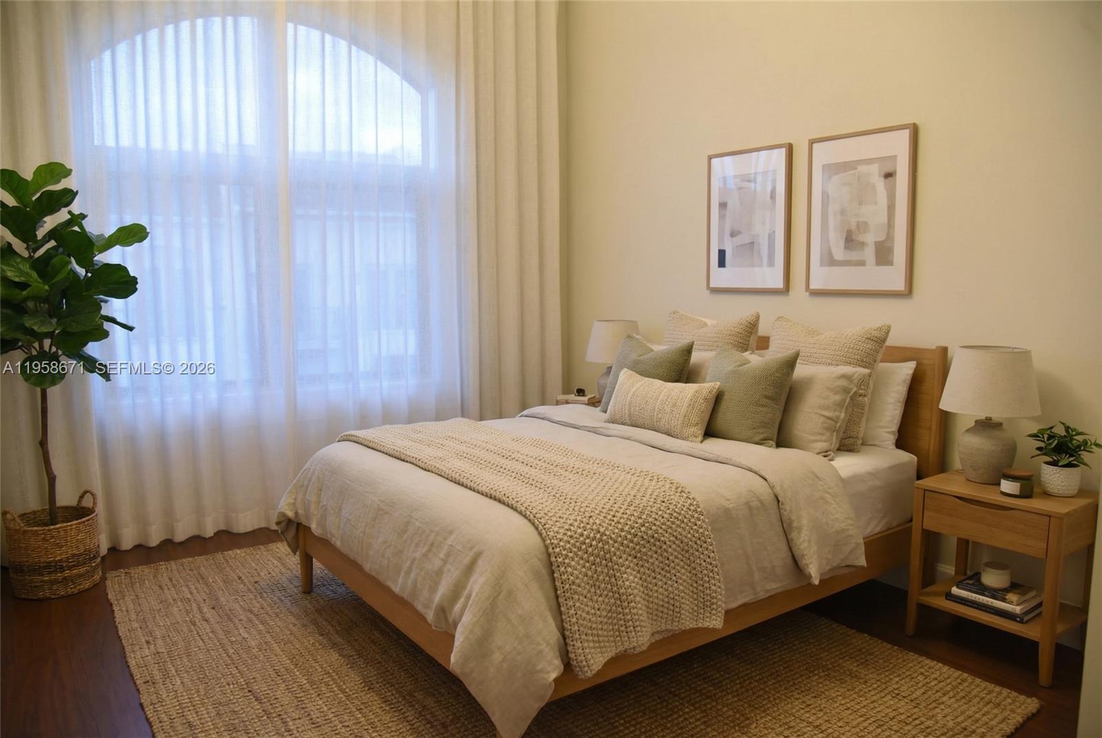 7560 Southwest 56th Court Miami, FL 33143 - Photo 22 of 30 a large bed sitting in a bedroom next to a window