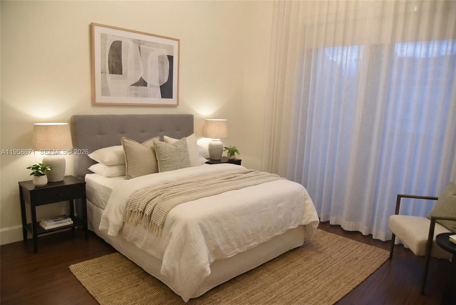 7560 Southwest 56th Court Miami, FL 33143 - Photo 23 of 30 a large bed sitting in a bedroom next to a window