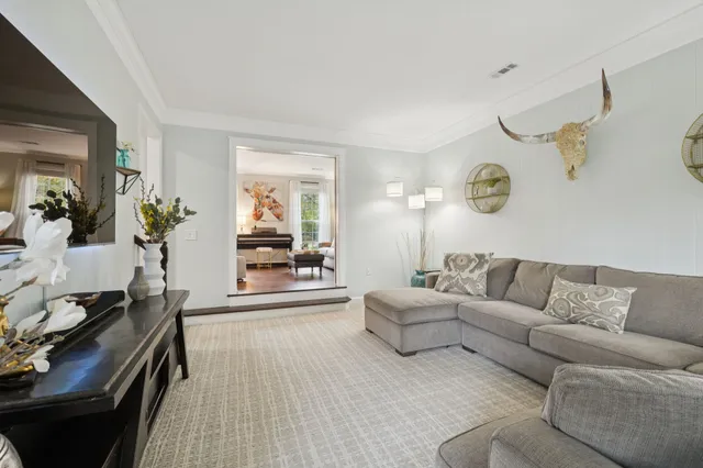 a living room with furniture and a couch