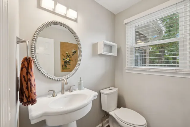 a view of a dining room with furniture and a chandelier
