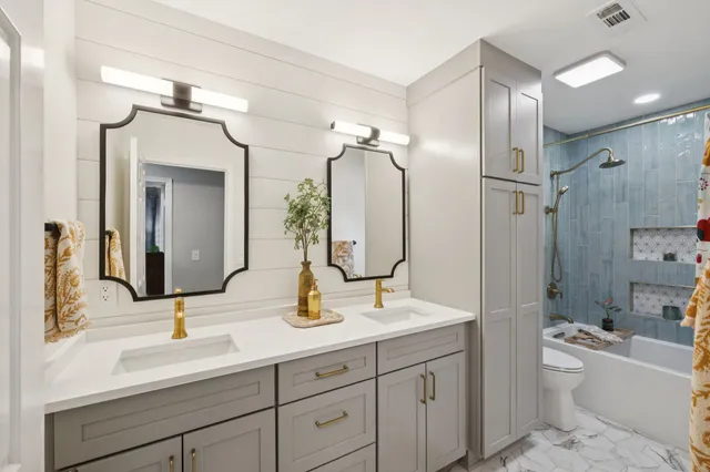 a spacious bedroom with a bed couch and a window