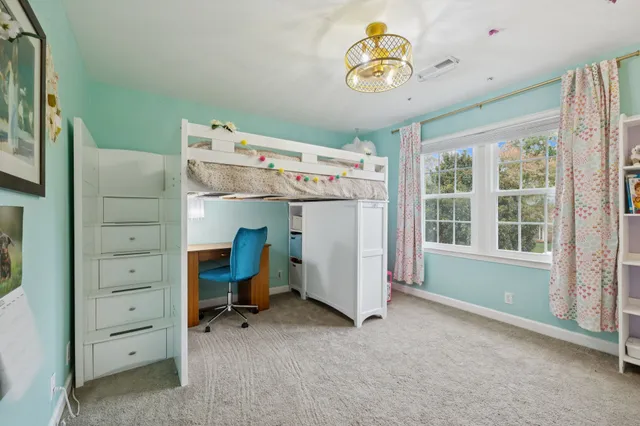a patio with hardwood table and chairs