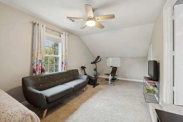a view of a house with backyard porch and sitting area