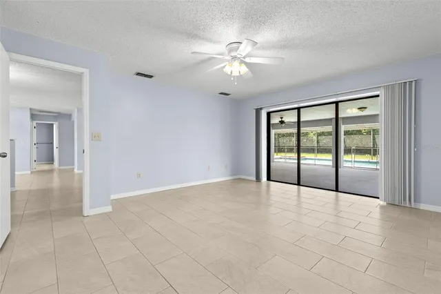 a bedroom with a bed and a ceiling fan