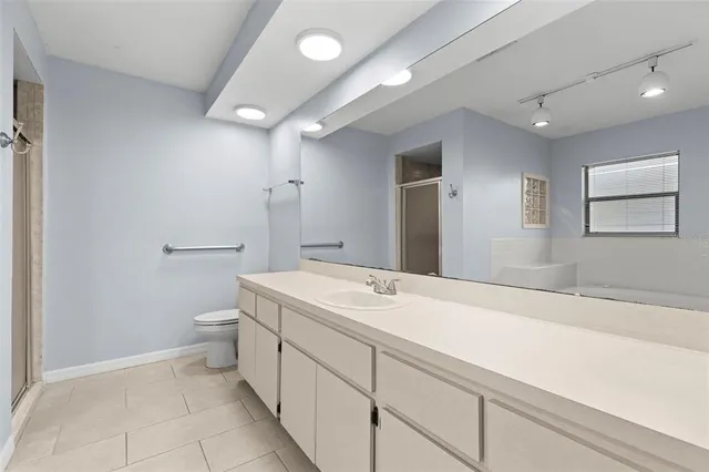 a bathroom with a bathtub and a window