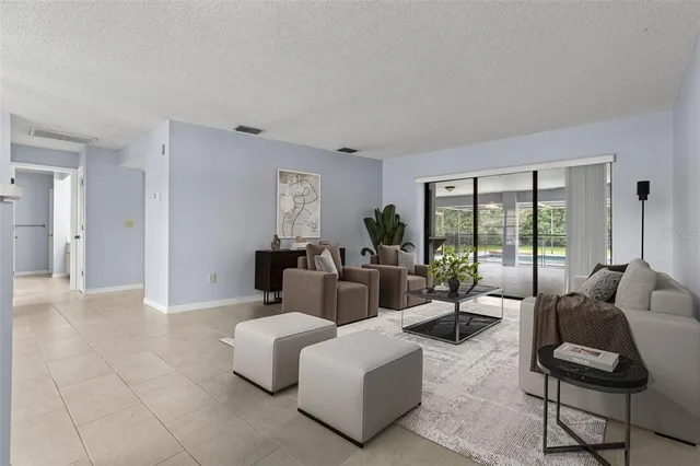 a living room with furniture and a large window