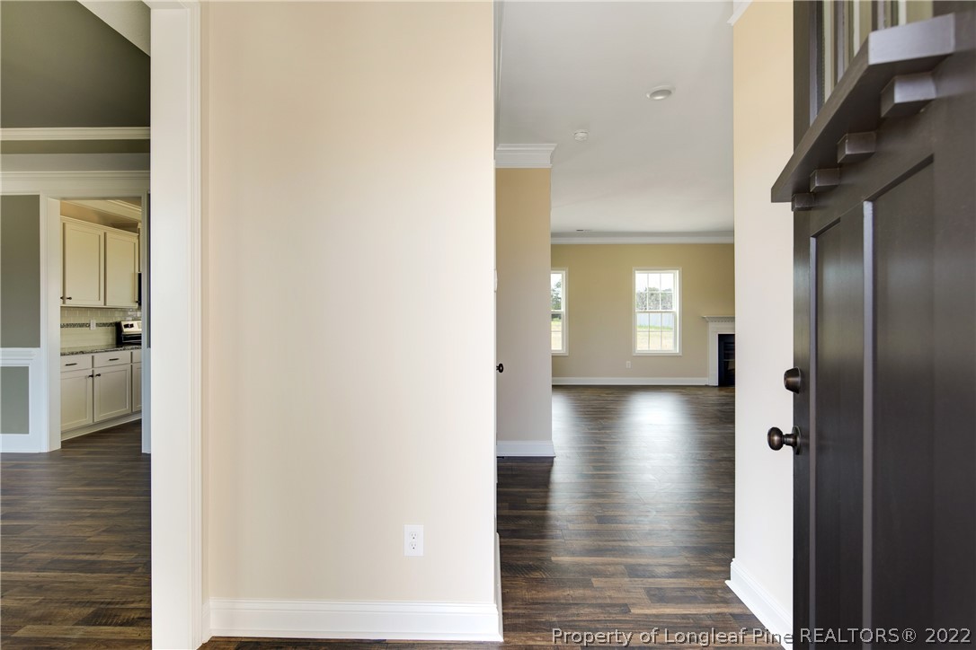 2605 Riddle Farm Hope Mills, NC 28348 - Photo 5 of 50 a view of a hallway with wooden floor and staircase