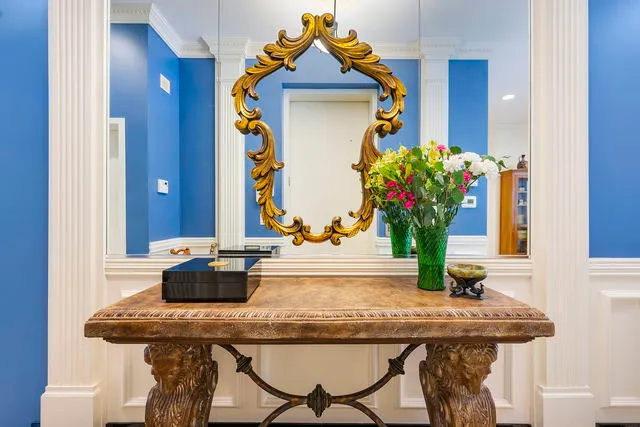 a dining table with chairs and wooden floor