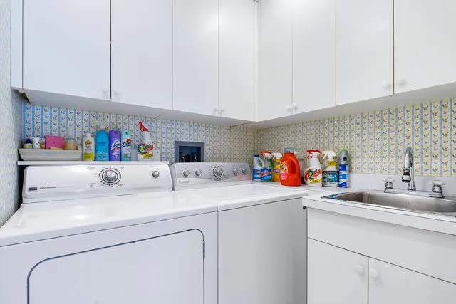 a utility room with sink and a vanity