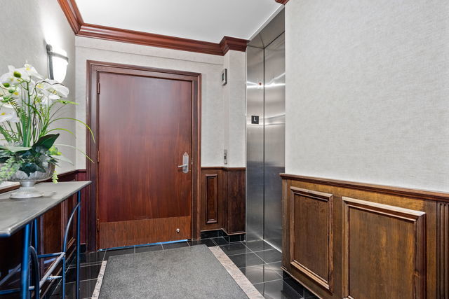 45 East Cedar Street, Unit 200 Chicago, IL 60611 - Photo 31 of 35 a view of closet with wooden floor