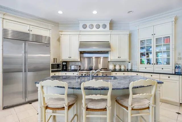 a kitchen with counter top space cabinets and stainless steel appliances