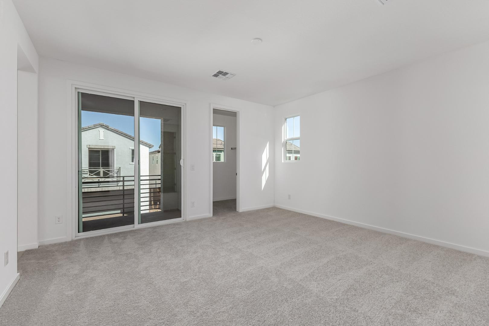 2436 West Maximo Way Phoenix, AZ 85085 - Photo 13 of 37 an empty room with closet and windows