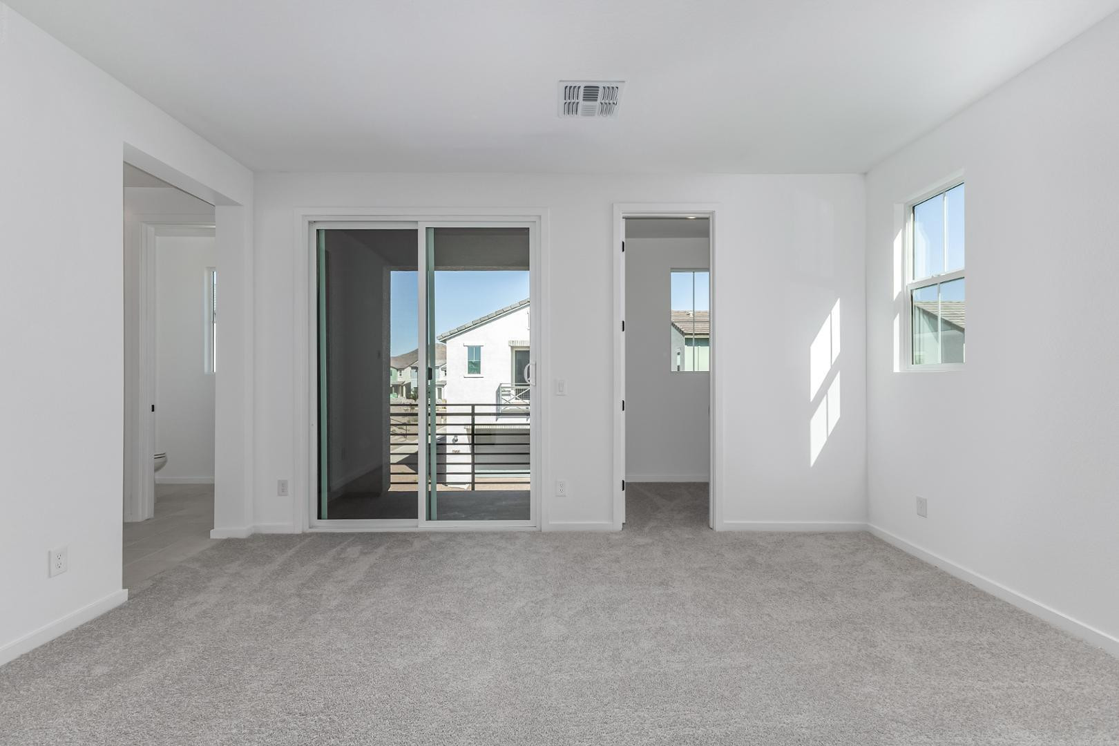 2436 West Maximo Way Phoenix, AZ 85085 - Photo 17 of 37 an empty room with windows
