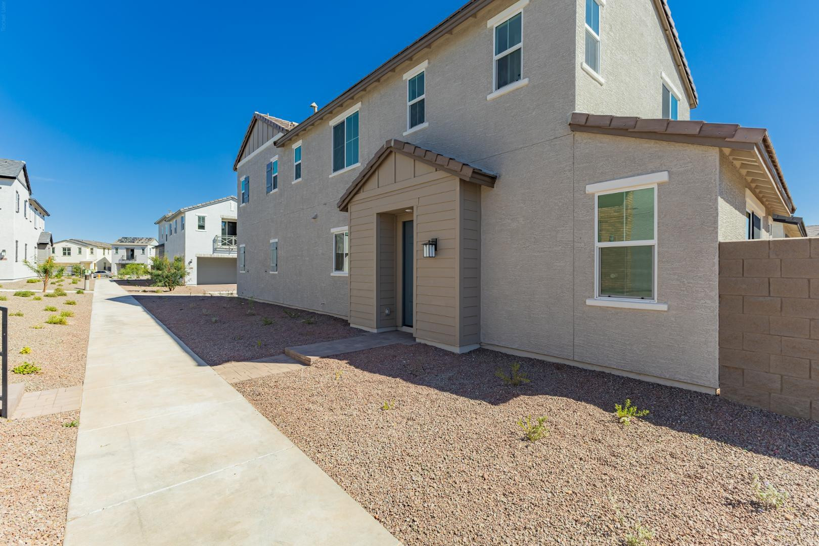 2436 West Maximo Way Phoenix, AZ 85085 - Photo 2 of 37 a view of a house with a snow in the yard
