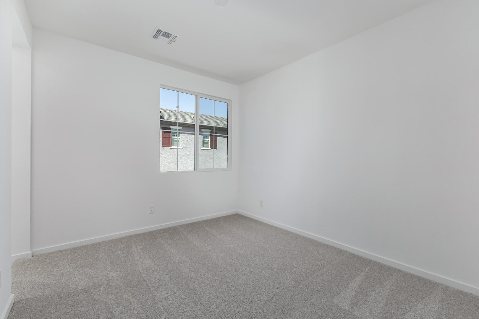 2436 West Maximo Way Phoenix, AZ 85085 - Photo 25 of 37 an empty room with a window