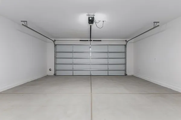 a view of a room with a ceiling fan