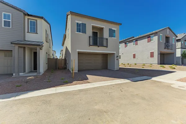 a backyard of a house with wooden fence