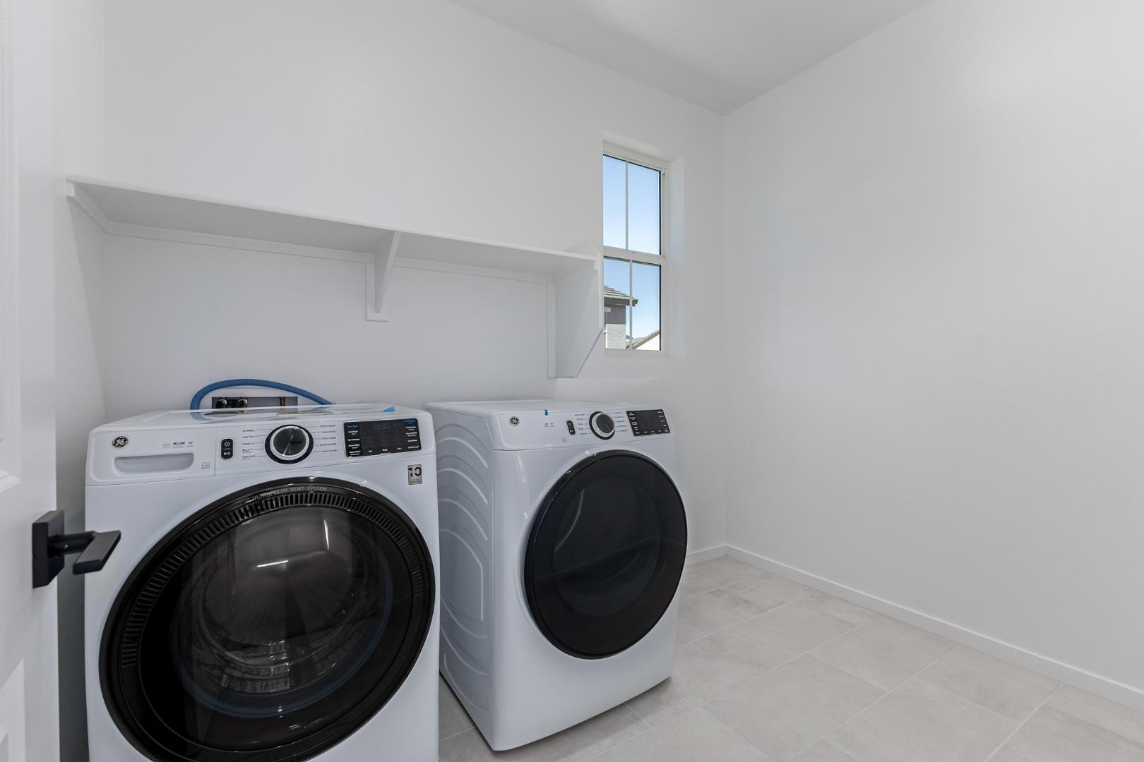 2436 West Maximo Way Phoenix, AZ 85085 - Photo 36 of 37 a utility room with dryer and washer
