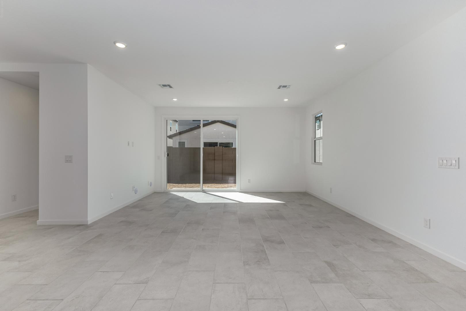 2436 West Maximo Way Phoenix, AZ 85085 - Photo 6 of 37 an empty room with a empty space and windows