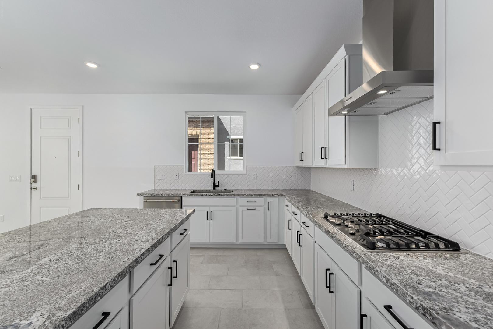 2436 West Maximo Way Phoenix, AZ 85085 - Photo 8 of 37 a kitchen with granite countertop a sink stove and cabinets