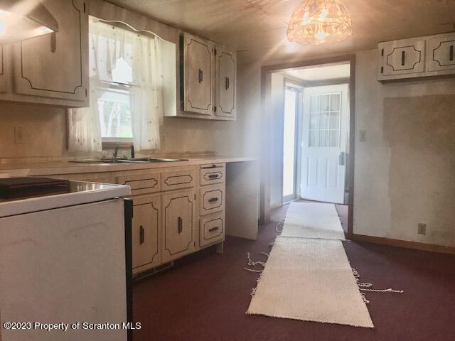 2795 Aberdeen Road Moscow, PA 18444 - Photo 3 of 19 a kitchen with stainless steel appliances granite countertop a sink a stove and a refrigerator
