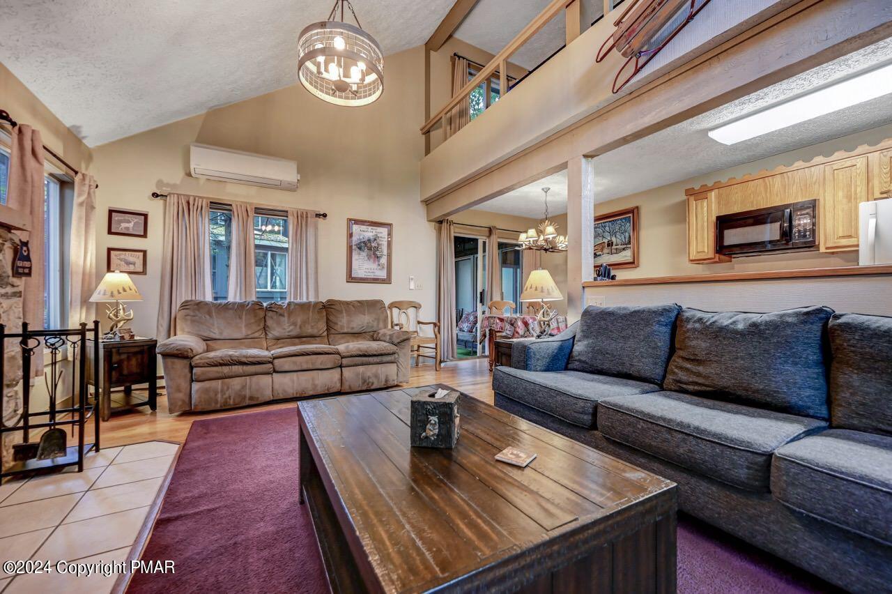 103 Telemark Lake Harmony, PA 18624 - Photo 19 of 68 a living room with furniture and a table