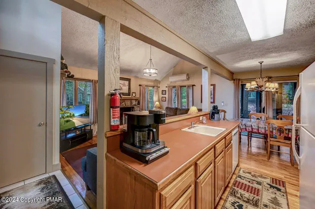 a room with fireplace furniture and a wooden floor