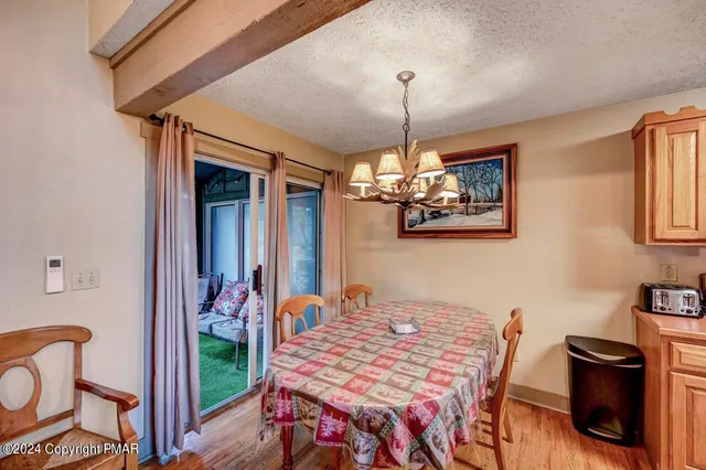 a bedroom with a bed and a large mirror on dresser