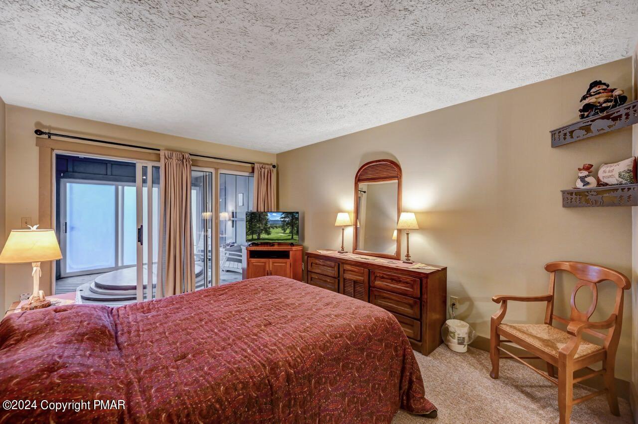 103 Telemark Lake Harmony, PA 18624 - Photo 30 of 68 a bedroom with a bed and a dresser in it