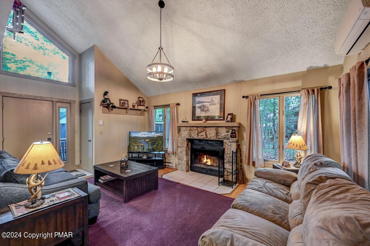 103 Telemark Lake Harmony, PA 18624 - Photo 5 of 68 a living room with furniture and a fireplace