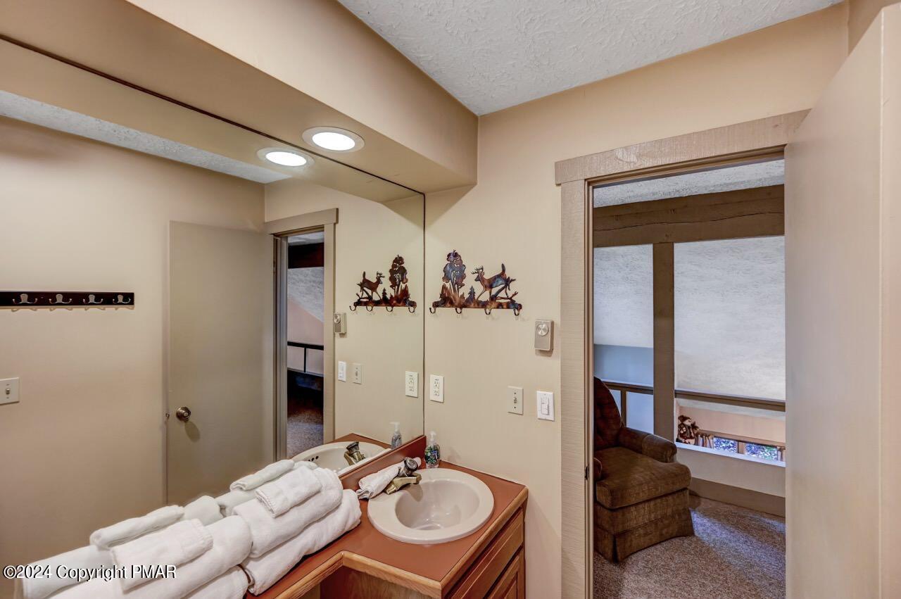 103 Telemark Lake Harmony, PA 18624 - Photo 53 of 68 a bathroom with a sink and a mirror