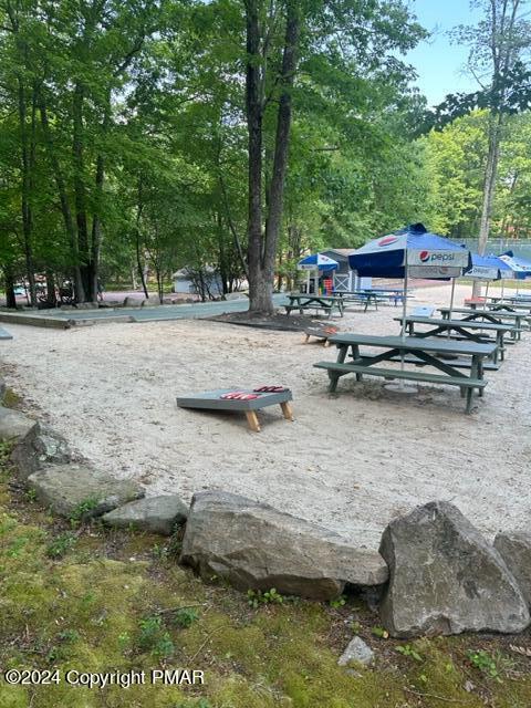 103 Telemark Lake Harmony, PA 18624 - Photo 62 of 68 a view of swimming pool with lawn chairs and plants