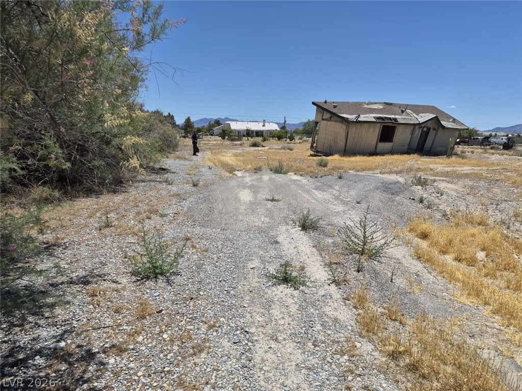 2271 Tough Boy Road Pahrump, NV 89060 - Photo 1 of 12 A spacious, open parcel awaits your vision with a desert landscape and mountain vistas.