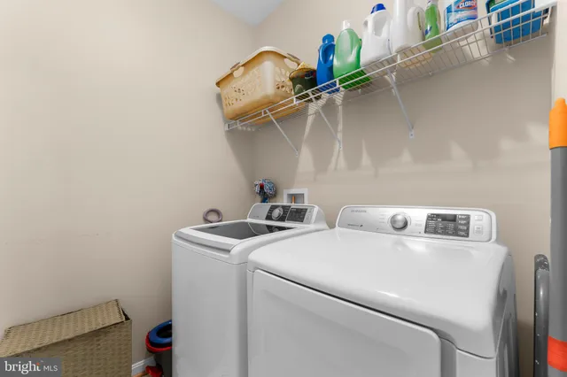 a view of a hallway with wooden floor and windows