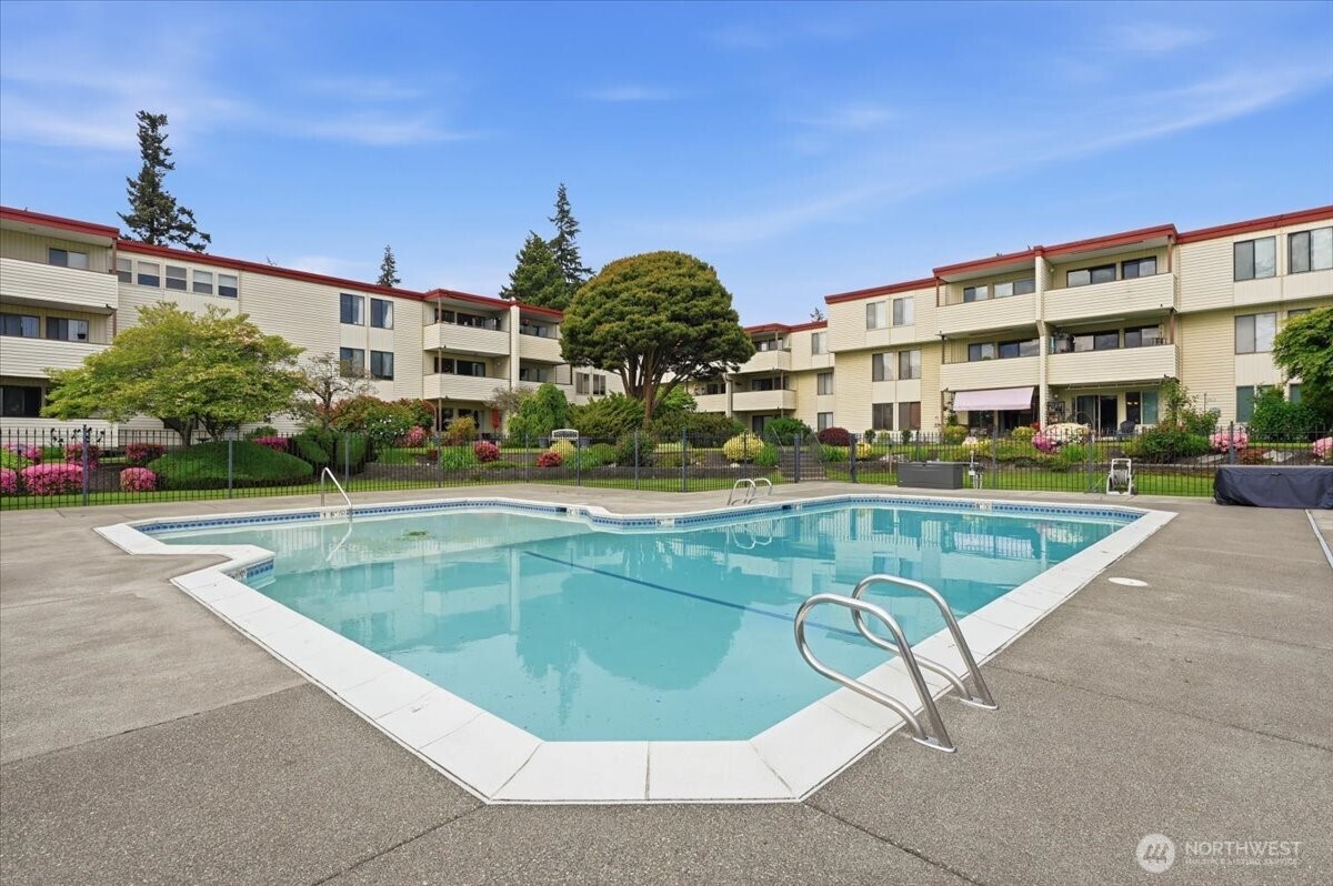 8516 196th Street Southwest, Unit 204 Edmonds, WA 98026 - Photo 3 of 16 a view of a swimming pool with a patio