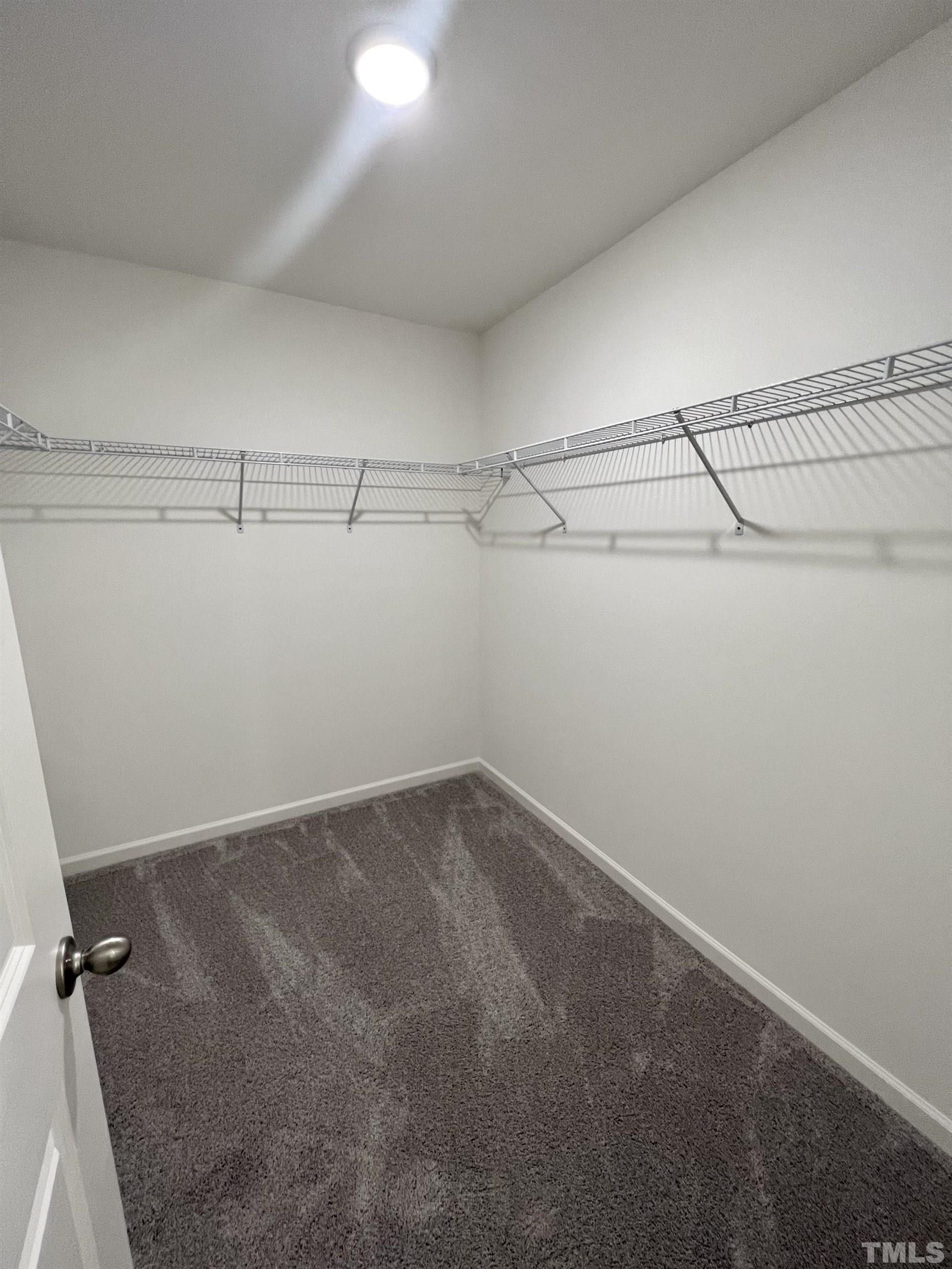 3403 C Walker Drive Wilson, NC 27893 - Photo 16 of 26 a view of a room with racks on the wall