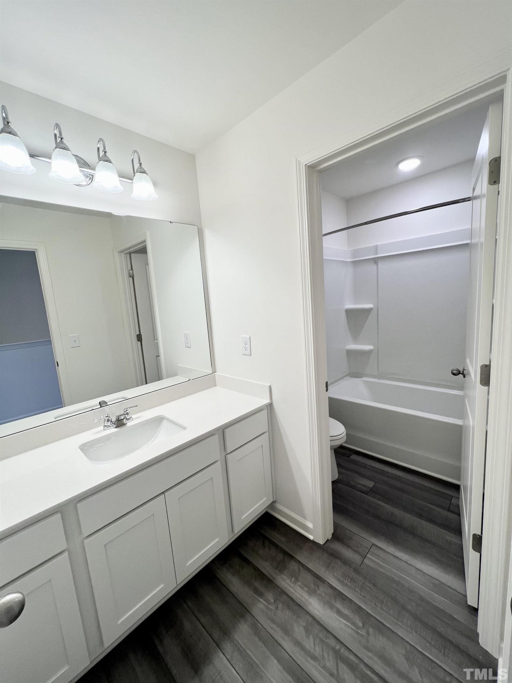 3403 C Walker Drive Wilson, NC 27893 - Photo 21 of 26 a bathroom with a double vanity sink and mirror