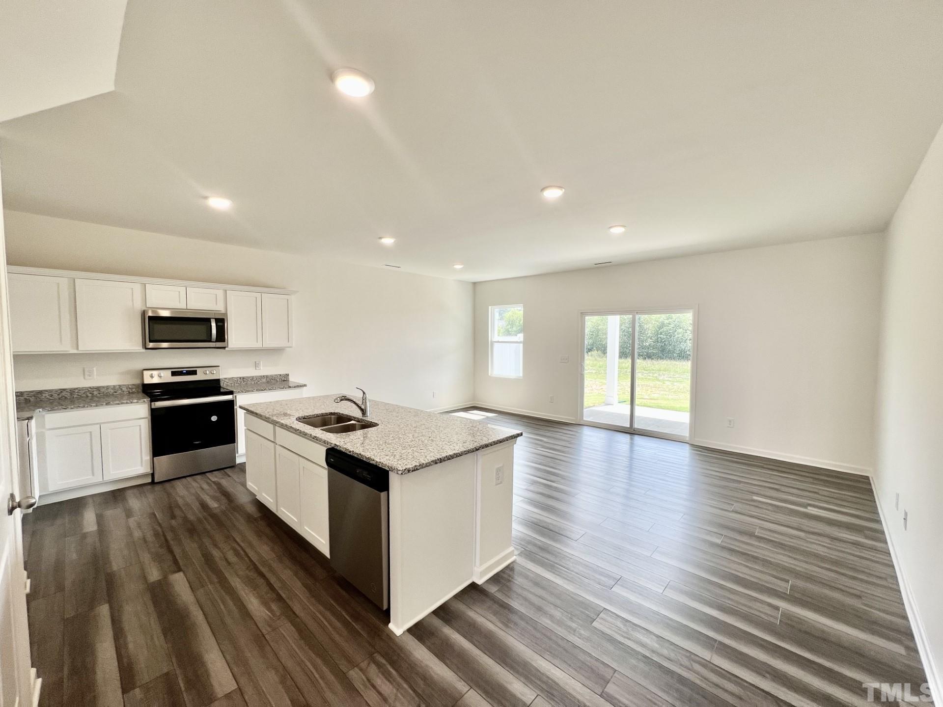 3403 C Walker Drive Wilson, NC 27893 - Photo 5 of 26 a kitchen with granite countertop a stove and a sink