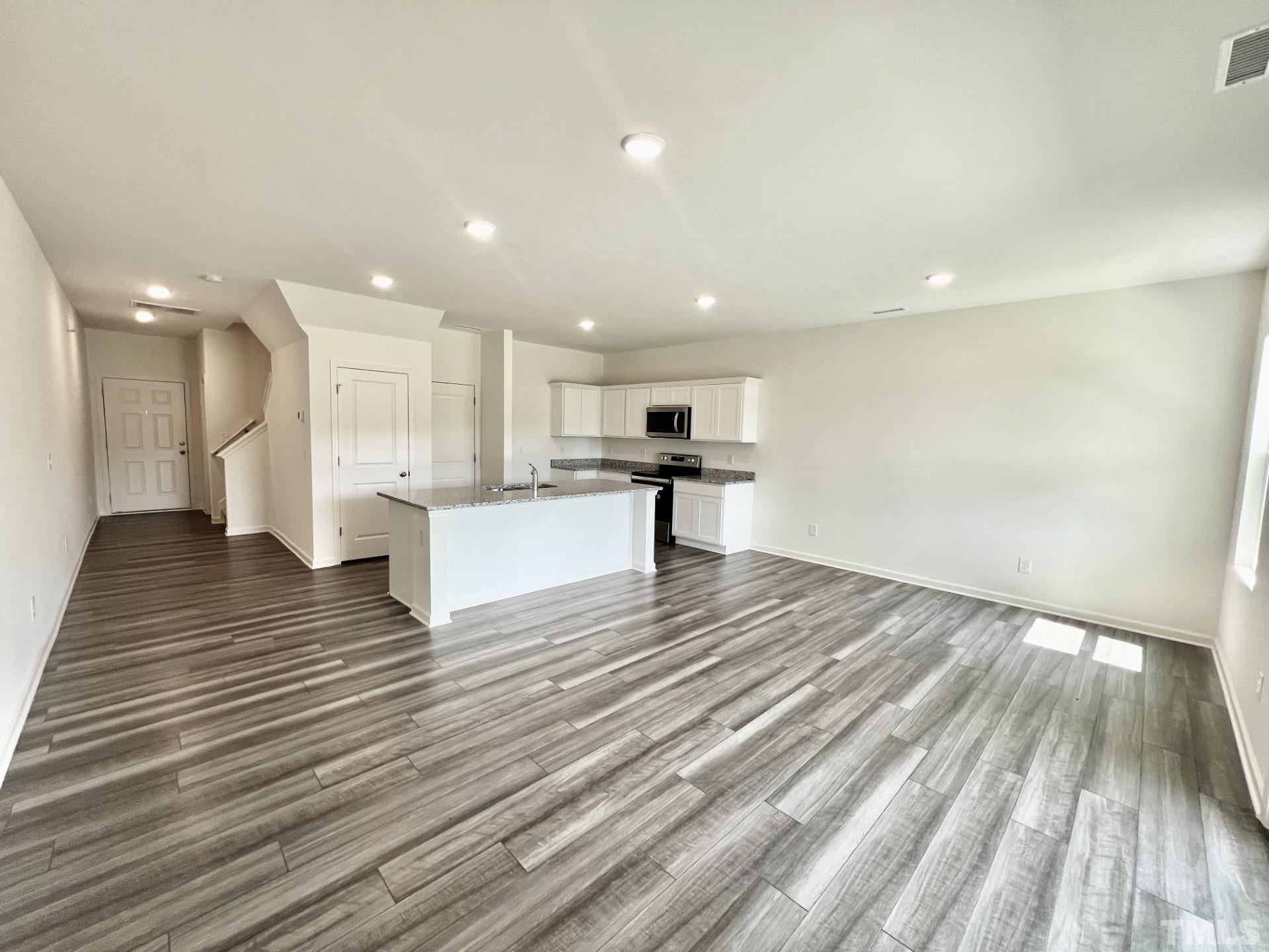 3403 C Walker Drive Wilson, NC 27893 - Photo 7 of 26 a view of kitchen and hall with wooden floor