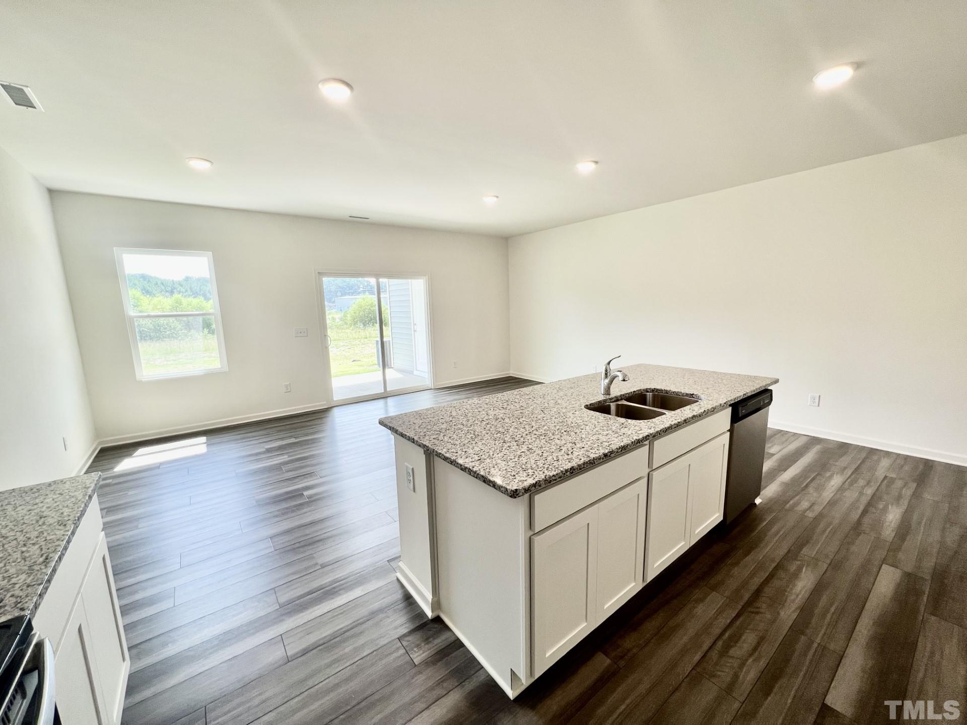 3403 C Walker Drive Wilson, NC 27893 - Photo 10 of 26 a kitchen with a stove and wooden floor