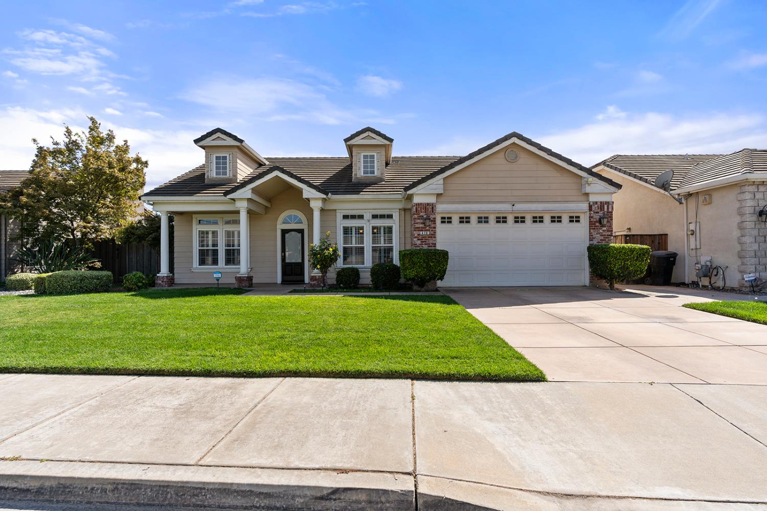 478 East Milgeo Road Ripon, CA 95366 - Photo 1 of 1 a front view of a house with a garden and yard