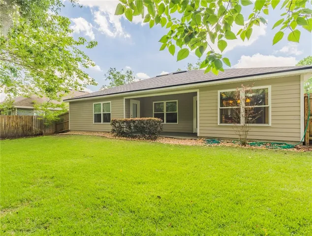 a front view of house with yard and seating area