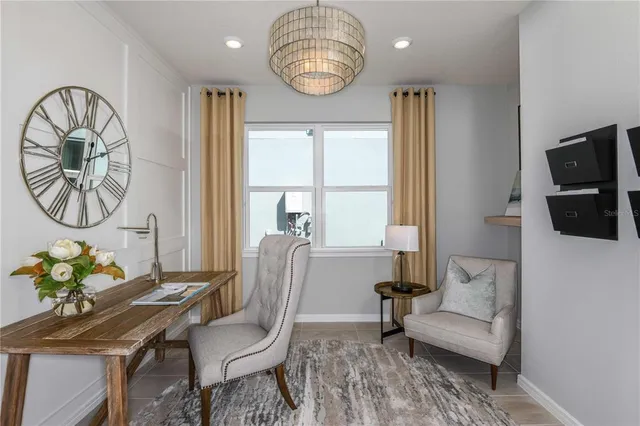 a living room with furniture a table and a window