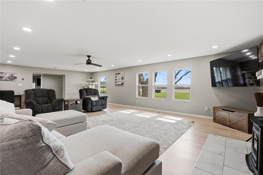 2950 Fairfield Pike Springfield, OH 45502 - Photo 12 of 48 This airy living room features expansive windows, sleek hardwood floors, and abundant natural light.