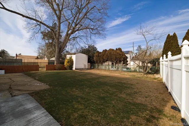 a view of yard with patio
