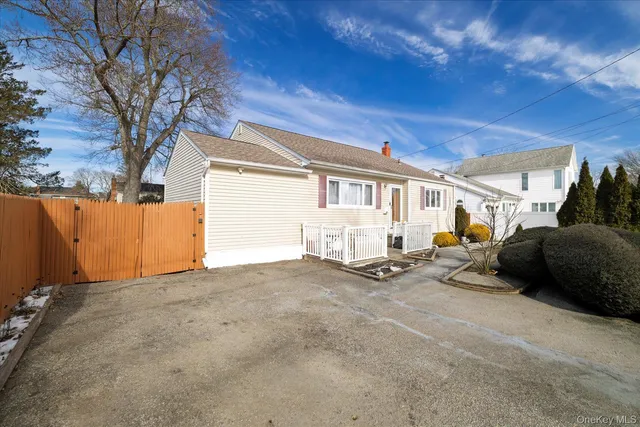 a view of a house with a yard and garage