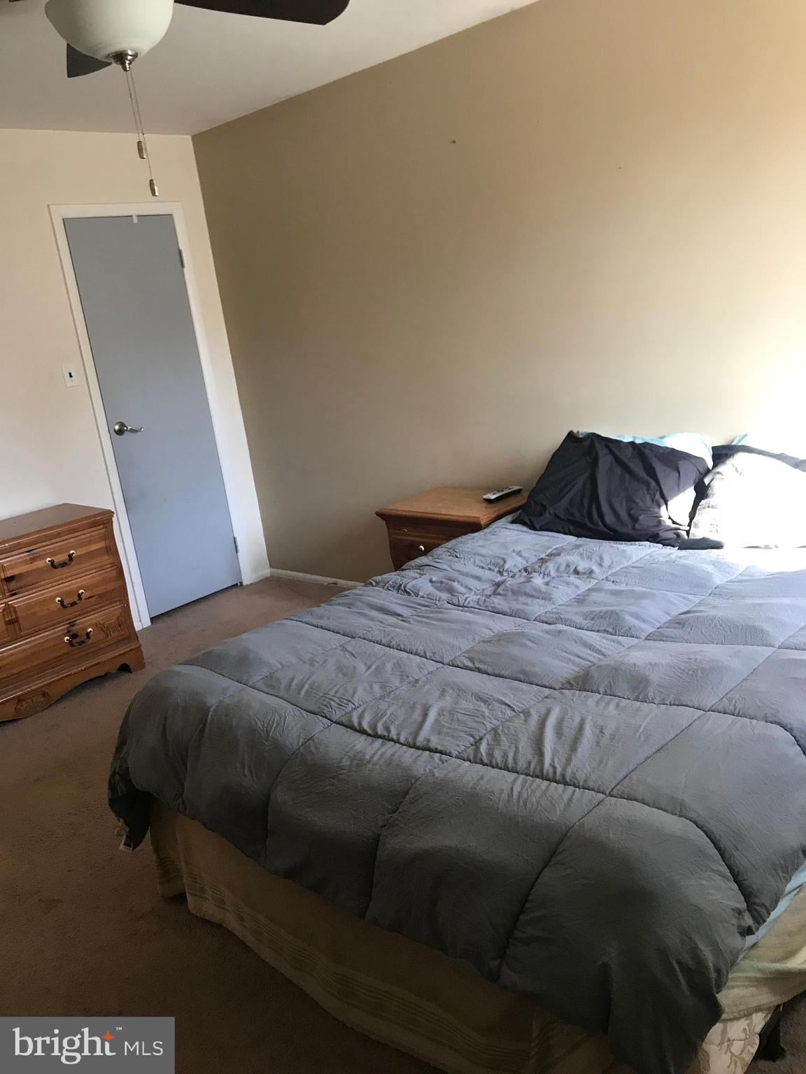 9585 James Street, Unit B Philadelphia, PA 19114 - Photo 12 of 26 a bedroom with a bed and a couch