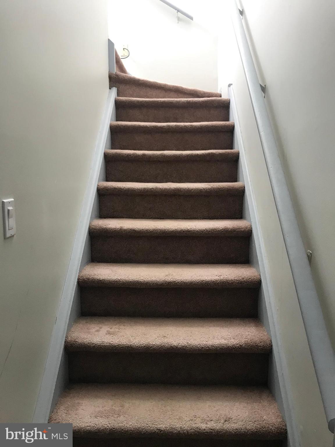 9585 James Street, Unit B Philadelphia, PA 19114 - Photo 17 of 26 a view of staircase with white walls