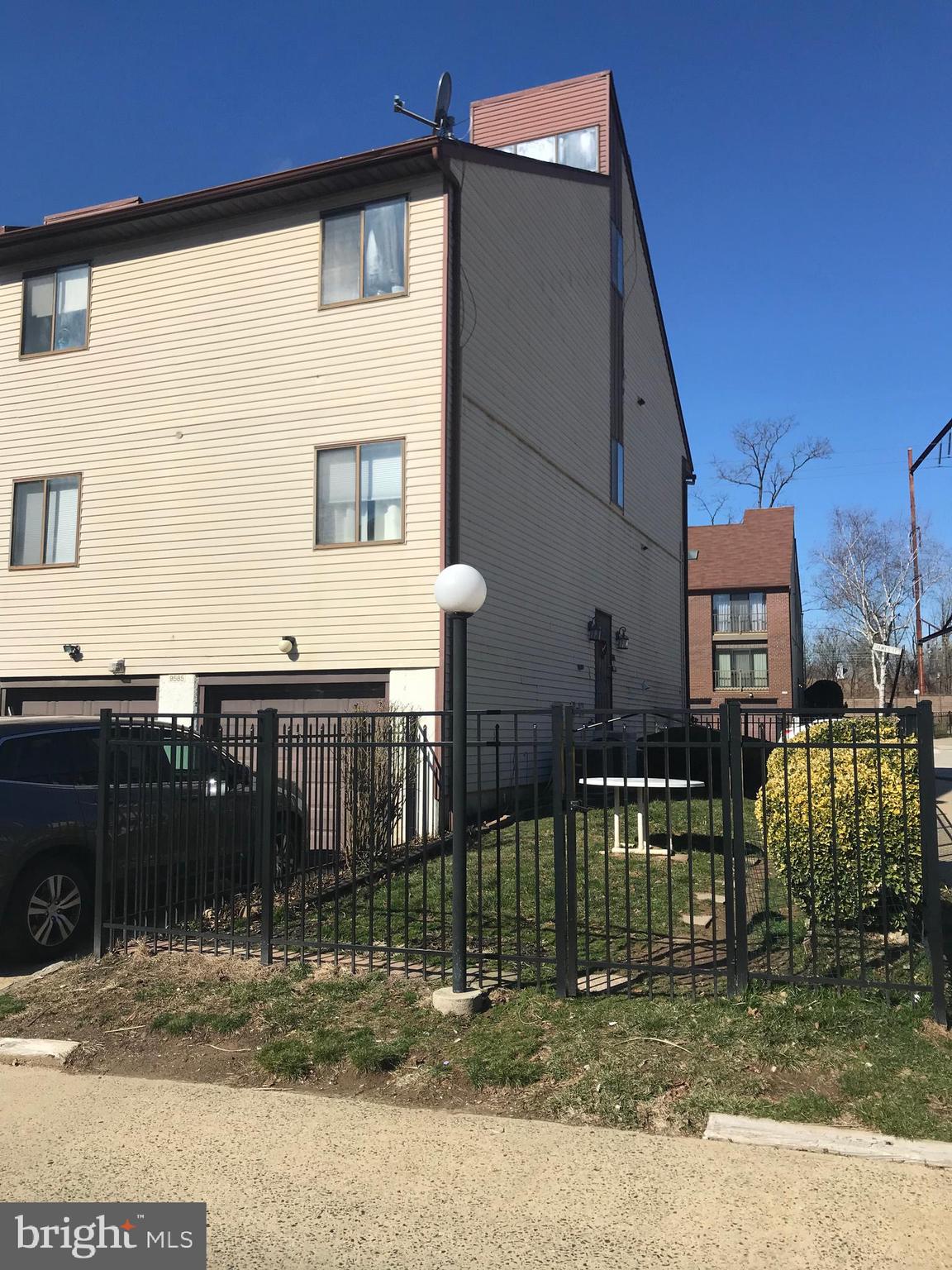 9585 James Street, Unit B Philadelphia, PA 19114 - Photo 25 of 26 a front view of a house with a yard