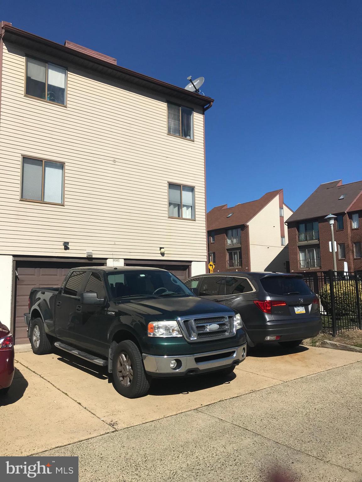 9585 James Street, Unit B Philadelphia, PA 19114 - Photo 26 of 26 a view of a car in front of a house
